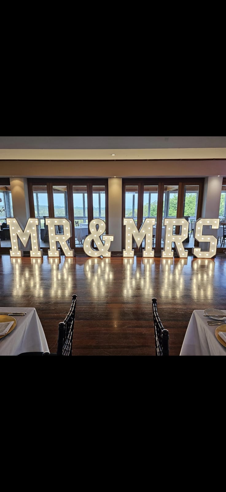 Tall light-up marquee letters on display